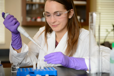 graduate research student Katelyn Senkus in the lab.