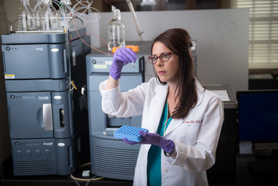 Dr. Crowe-White analyzes samples for mass spec analysis.
