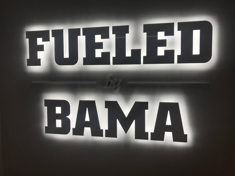 Signage for Fueled by BAMA Nutrition.